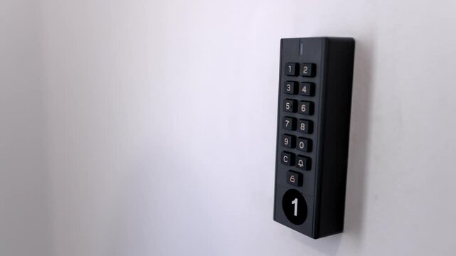 Close-up of a person unlocking a residential property with a digital keypad, highlighting secure keyless entry and contactless tourism solutions.