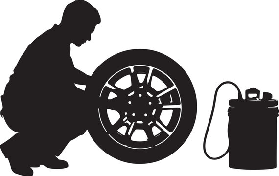 Silhouette of a man inflating a tire with an air compressor