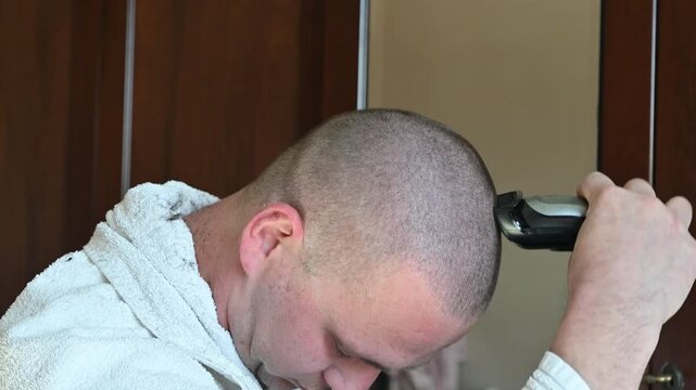 Woman Giving Her Husband a Buzz Cut at Home