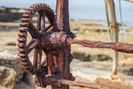 Vintage rusty boat winch mechanism on the coast of Savudrija, Istria, Croatia.