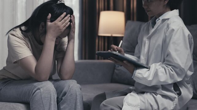 Healthcare caregiver taking notes while supporting a teenager with depression. Mental health, counseling, emotional support, therapy, recovery, empathy, 4K.