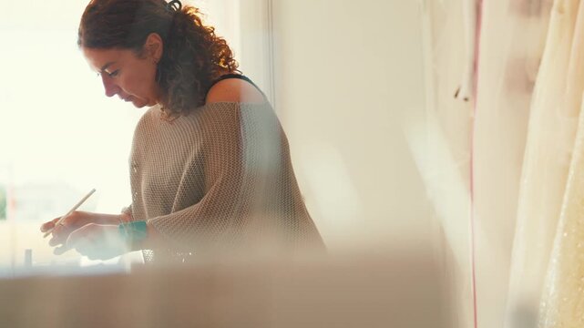Creating art in a bright studio during the day with a focus on crafts and tools