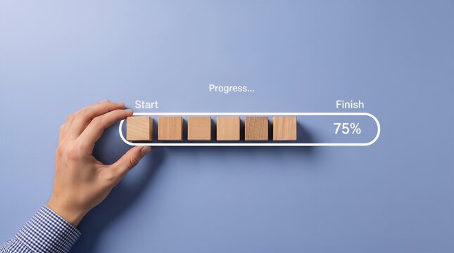 Human hand completing a loading progress bar with wooden blocks representing seventy five percent project task completion status progress completion business deadline