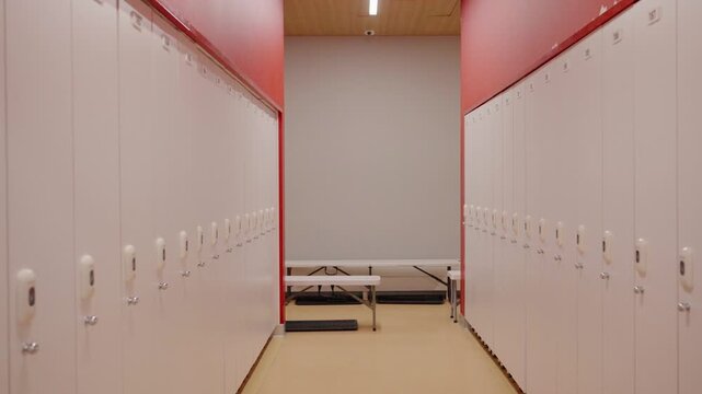 Empty modern locker room moving forward pov