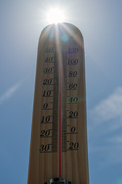 Wooden Thermometer Indicating Extreme Heat and Rising Summer Temperatures
