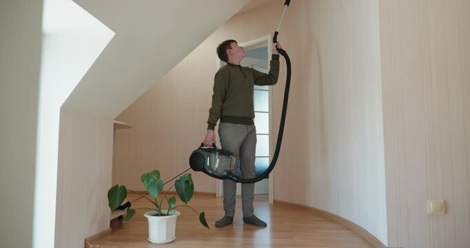 Caucasian Boy Kid Vacuum Hallway Corridor in House. 4K 10-bit