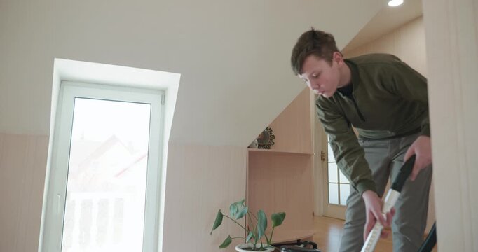 Caucasian Boy Kid Vacuum Hallway Corridor in House. 4K 10-bit