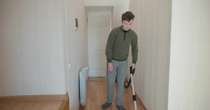 Caucasian Boy Kid Vacuum Hallway Corridor in House. 4K 10-bit