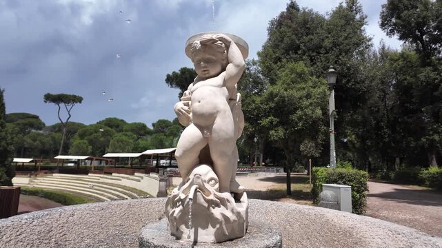 Cinematic Close-Up Of The Putto Riding A Dolphin Sculpture In Villa Borghese Gardens