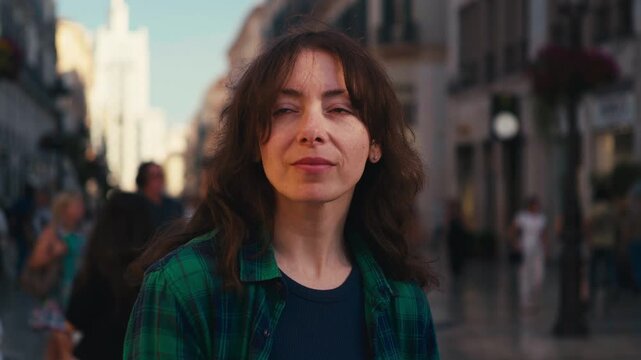 Woman lost in thought on a busy European street, radiating introspection and urban calm, perfect for corporate wellness and travel campaigns.