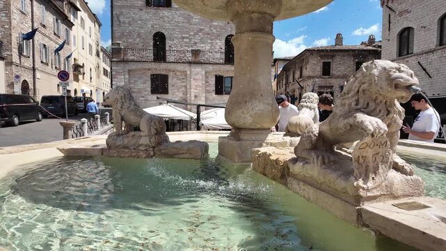 Cinematic View Of The Historic Fontana Dei Tre Leoni On Piazza Del Comune In Assisi