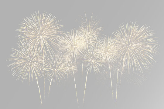 Multiple golden fireworks bursts with sparkling glowing lights, festive pyrotechnic celebration and bright display