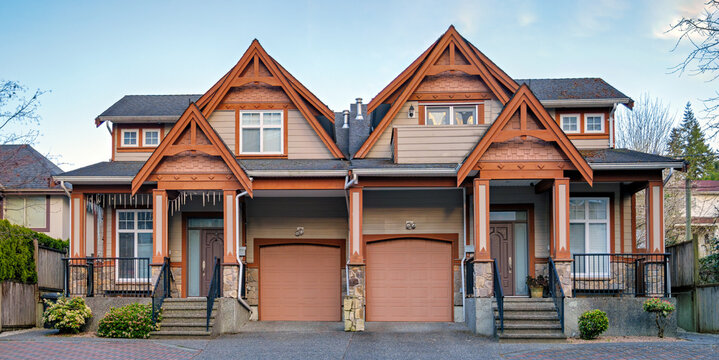Craftsman Style Duplex Townhouse with Separate Garages and Paved Driveway