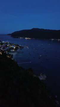 Vertical Aerial 4K Drone Footage Perhentian Kecil Malaysia Night Boat Lights