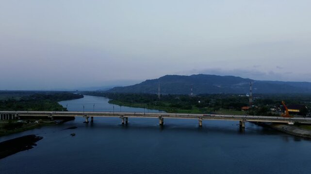 Aerial Drone View of Large Bridge Crossing River Estuary at Sunset