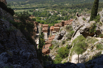 Fototapeta premium Panoramic View of Moustiers-Sainte-Marie from the Cliffside Path to Notre-Dame de Beauvoir, Provence, France.
