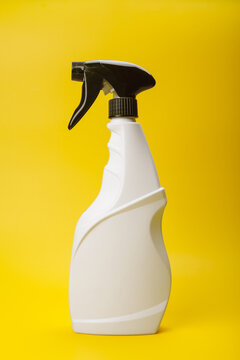 White Trigger Spray Bottle on Yellow