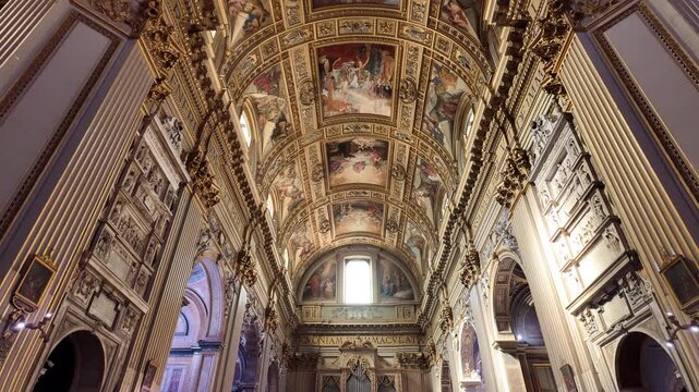 Ornate baroque ceiling frescoes and grand interior of Rome basilica