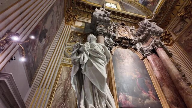 Virtues and angel statues decorating Cappella San Gaetano Thiene in Rome