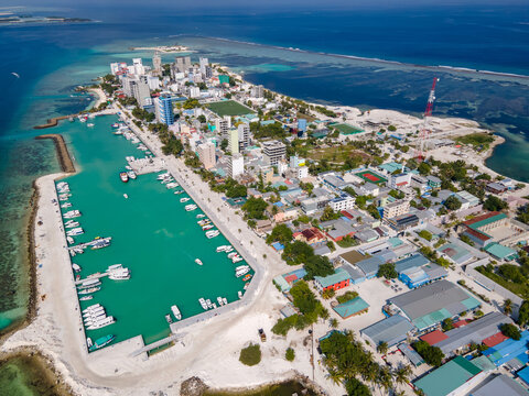 Aerial drone view of Maafushi, one of the inhabited islands of Kaafu Atoll in the Maldives. Maafushi island is popular for budget travel in Maldives.