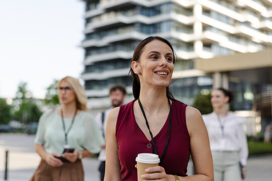 Group of professionals walking together in modern urban setting