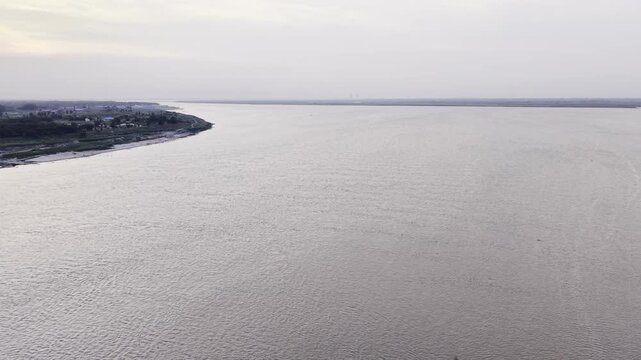 Drone Ascending Over a River Confluence and Rural Landscape in Bangladesh

