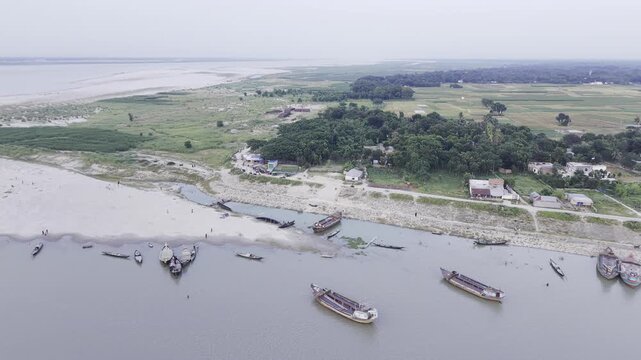 Slow Left Pan Drone View of Fishing Boats and Padma Gorai Confluence in Kushtia, Bangladesh