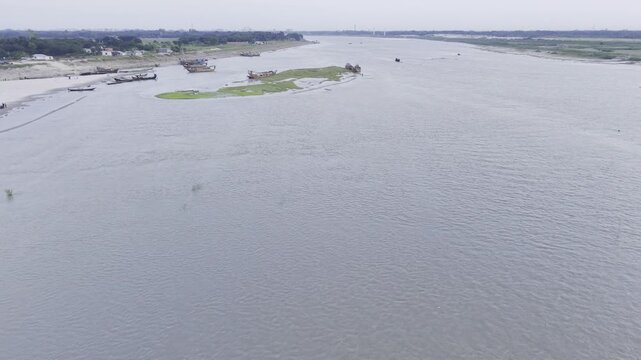 Forward Drone Flight Above Fishing Boats at the Padma Gorai Confluence
