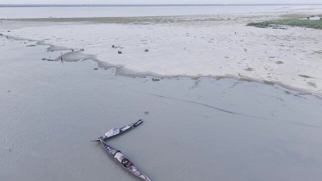 Low Forward Drone Flight Along the Padma Gorai River with Fishing Boats.