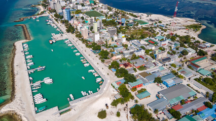 Aerial drone view of Maafushi, one of the inhabited islands of Kaafu Atoll in the Maldives. Maafushi island is popular for budget travel in Maldives. © zephyr_p