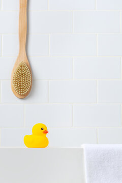Minimalist baby shower and hygiene mockup scene against white subway tile wall. Bright bathroom vanity backdrop with empty space for toddler shampoo, soap, or organic cosmetics.