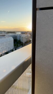 Spider Web on Balcony Railing at Sunset