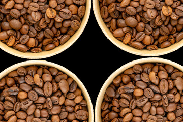 Fototapeta premium Roasted coffee beans isolated on black background. Top view.