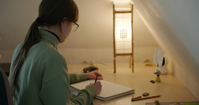 Girl Draw Pictures With Pencil on Desk Table in Bedroom at Home. 4K 10-bit