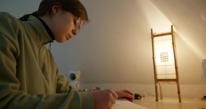 Girl Draw Pictures With Pencil on Desk Table in Bedroom at Home. 4K 10-bit