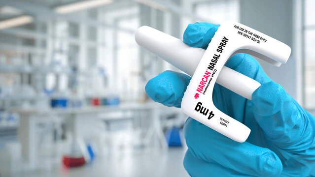 A doctor holds Narcan, a Naloxone nasal spray used for emergency opioid overdose reversal. This product is used in healthcare, addiction treatment, public health, and pharmaceuticals