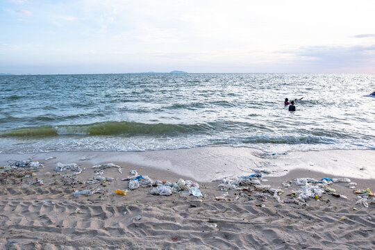 Dirty sea sandy shore ,Environmental pollution, Plastic water bottles pollution in ocean (Marine debris)	
