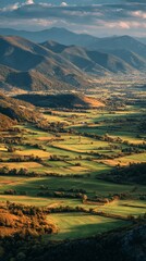 Fototapeta premium Rolling hills and mountains in a serene green valley at golden hour