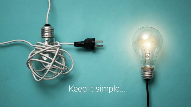 Tangled light bulb with cord and glowing light bulb on teal background