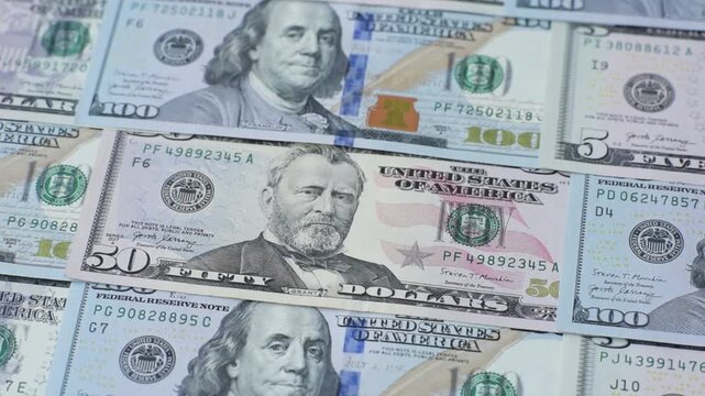 Paper US dollar bills of various denominations and cent coins as a business tool for exchange and trade. Cash US dollars as a background for your design