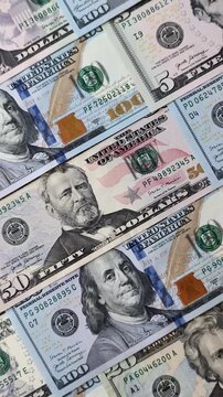 Paper US dollar bills of various denominations and cent coins as a business tool for exchange and trade. Cash US dollars as a background for your design