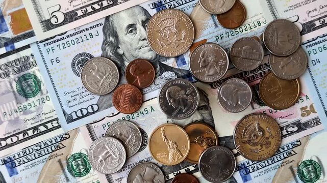 Paper US dollar bills of various denominations and cent coins as a business tool for exchange and trade. Cash US dollars as a background for your design