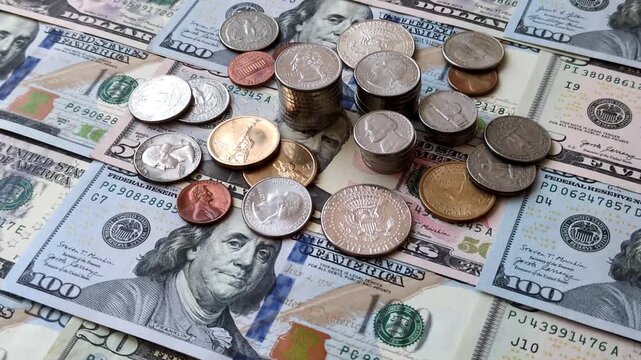Paper US dollar bills of various denominations and cent coins as a business tool for exchange and trade. Cash US dollars as a background for your design