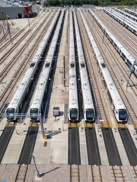Aerial view of the Old Oak Common Elizabeth Line Depot with multiple commuter trains parked on parallel tracks at the facility in London, England, United Kingdom.