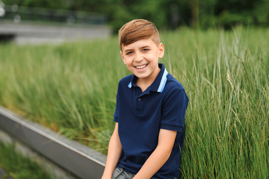 cute little child outside in summer season grass