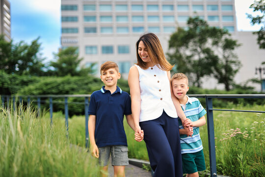 family of three outside people in summer season.