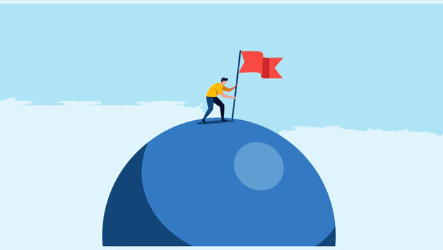 Man on top of mountain with flag, symbol of success and achievement