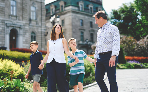 family having great time in city walking together