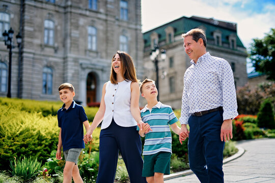family having great time in city walking together