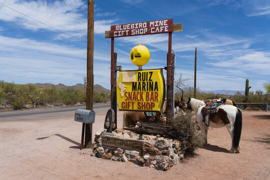 Vintage sign at the Blue Bird Mine Gift Shop with horses in Apache Junction, Arizona, April 2021